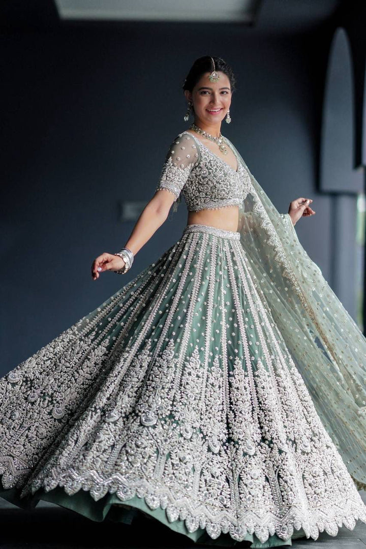 Mint Green Net with Heavy Dori Embroidery, Stone and Sequins Work Lehenga Choli