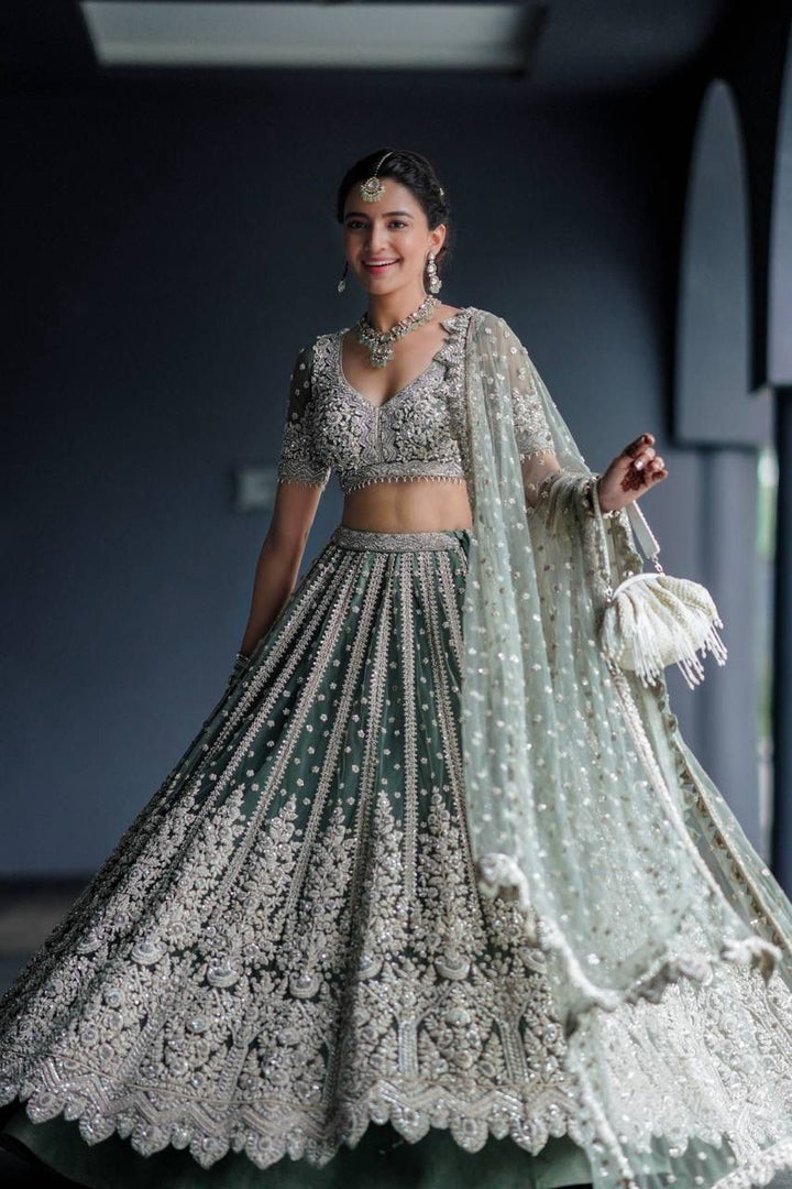 Mint Green Net with Heavy Dori Embroidery, Stone and Sequins Work Lehenga Choli