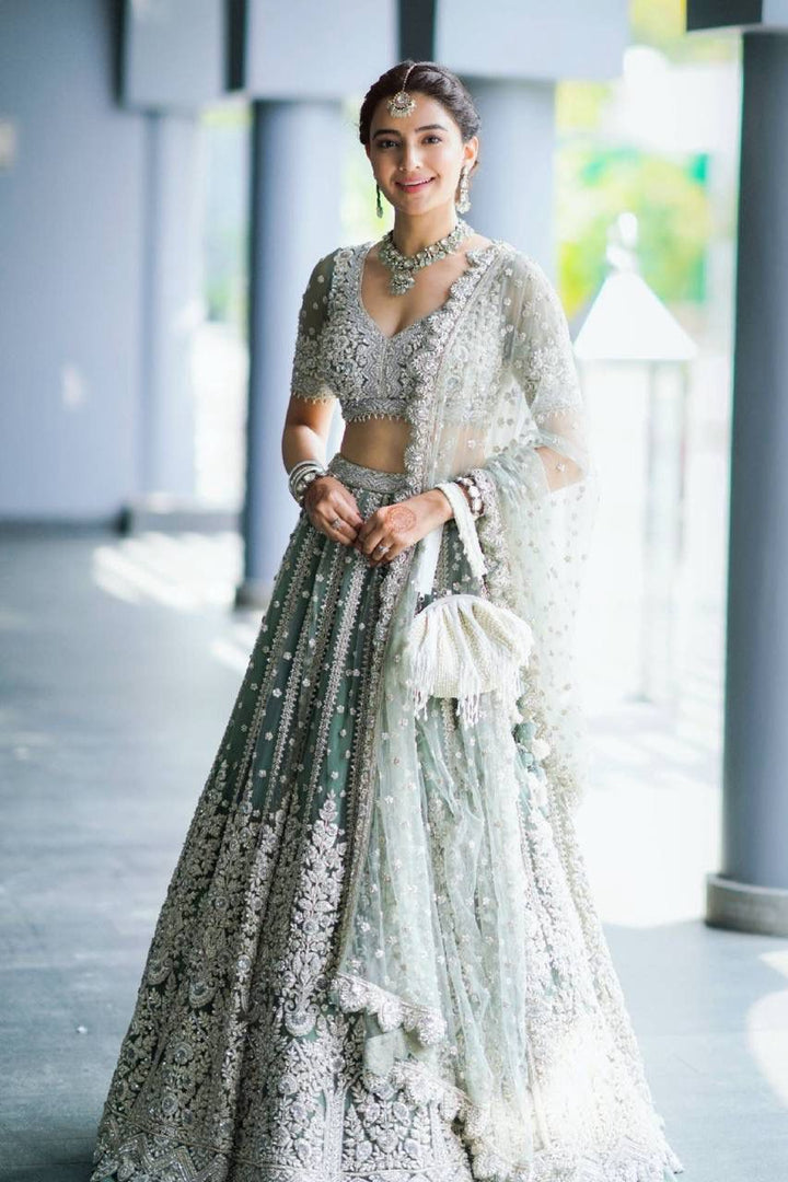 Mint Green Net with Heavy Dori Embroidery, Stone and Sequins Work Lehenga Choli