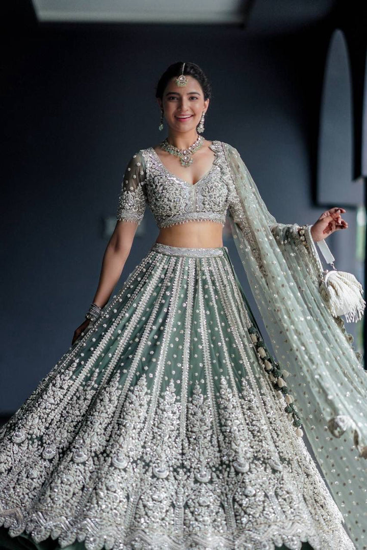 Mint Green Net with Heavy Dori Embroidery, Stone and Sequins Work Lehenga Choli