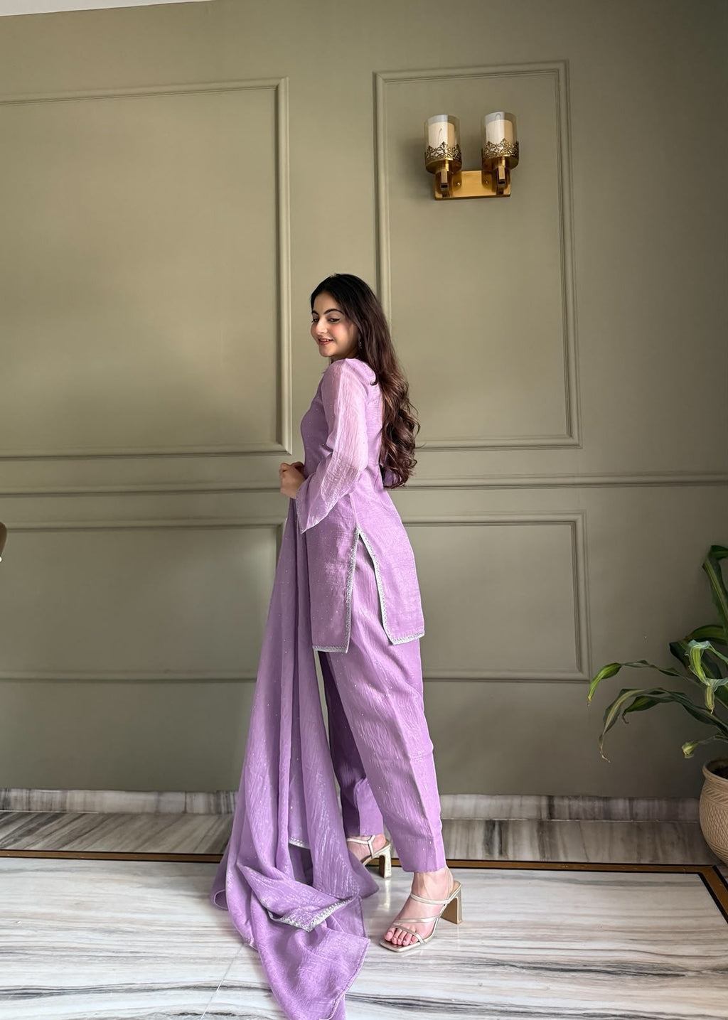 Inaaya Store lavender crunchy silk 3-piece suit with Siroski work and fancy lace trim worn by a woman