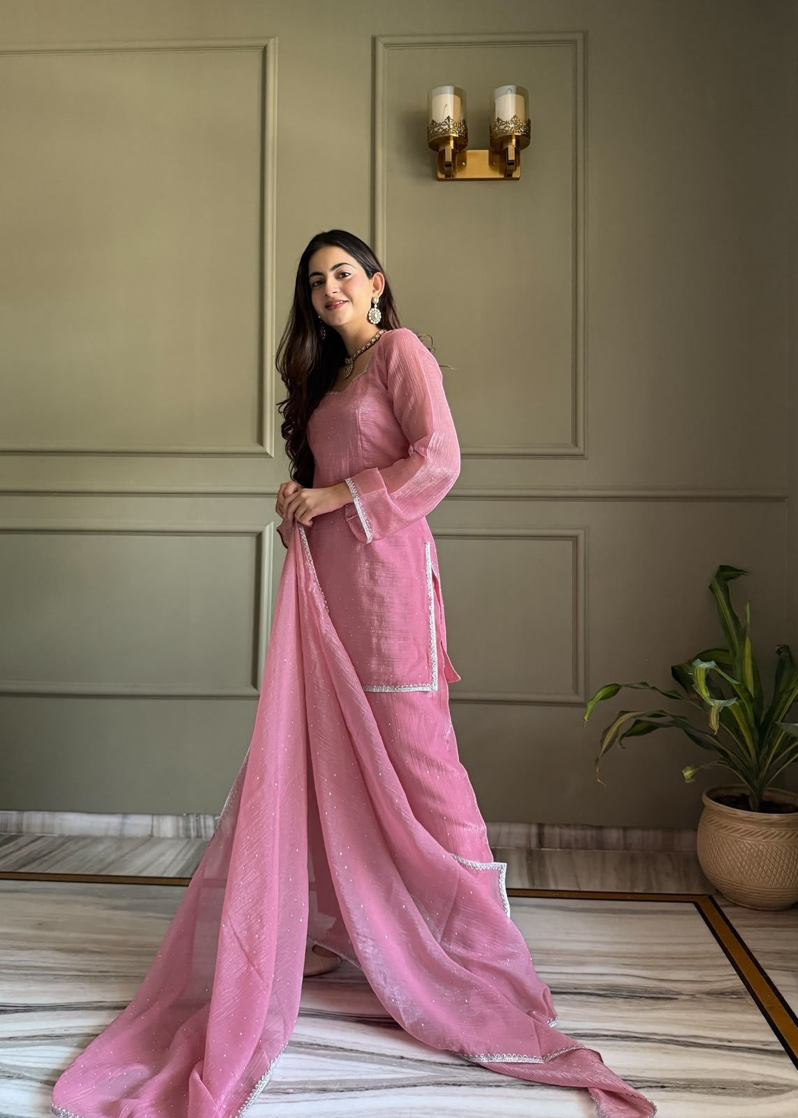 Inaaya Store pink crunchy silk Farshi Shalwar 3-piece suit with Siroski work and fancy lace trim on a model